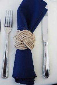 Nautical wedding ideas - necessary elements to comply with the theme. Cutlery and blue napkin
